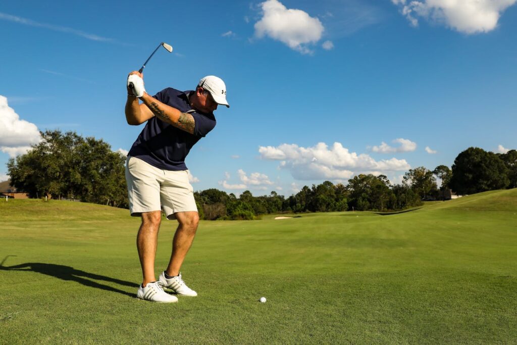 man trying techniques that help improve distance from the fairway.