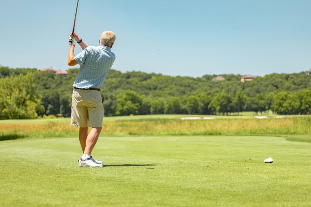 Golfer testing different grip technique to try and gain more distance from the tee.