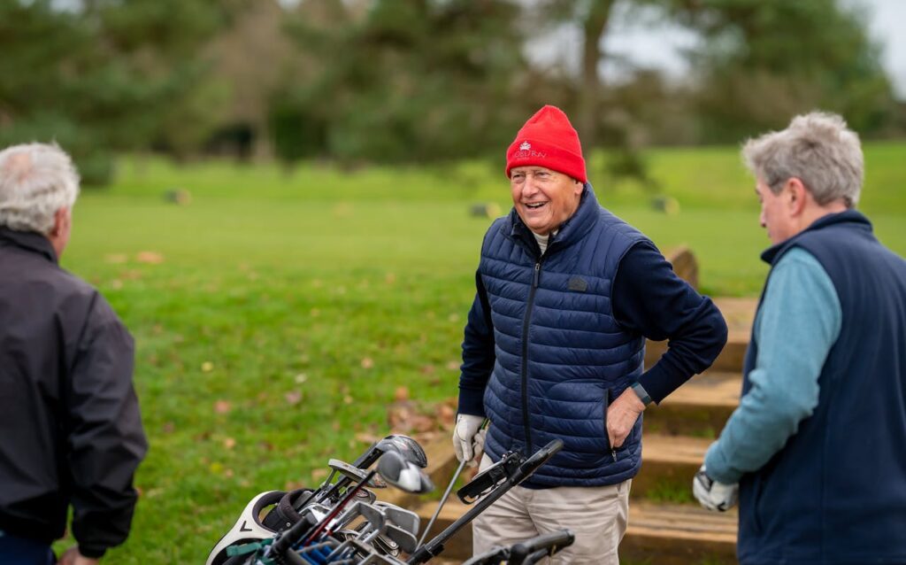 Group of friends enjoying learning how can seniors hit the golf ball further 